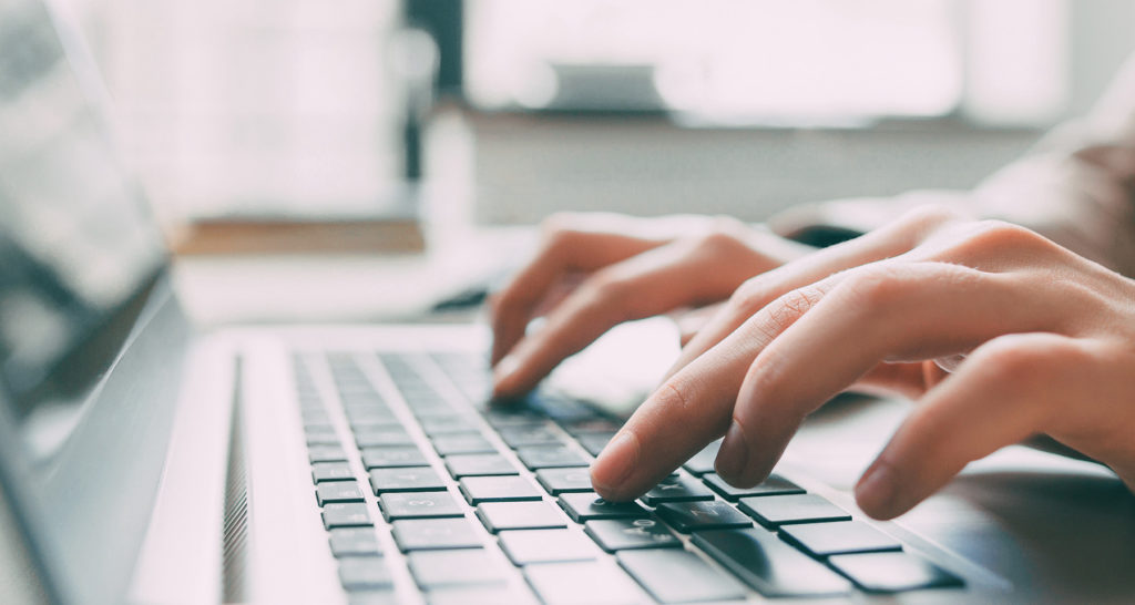 hands typing on pc laptop-internal blog